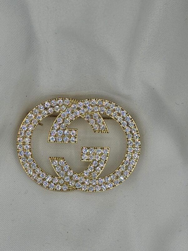 Gucci modeli taşlı gold gg broş