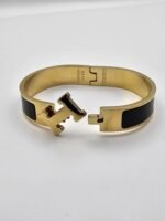 Hermes modeli siyah gold kelepçe h bileklik