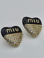 Miumiu modeli kalpli siyah mineli taşlı gold altın küpe