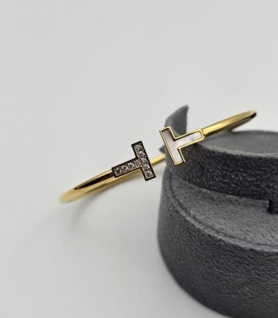 Tiffany modeli taşlı beyaz mineli gold bileklik